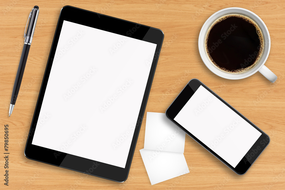 Tablet pc and mobile phone on office desk Tablet pc and mobile phone on office desk