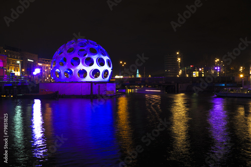 Photography AMSTERDAM, NETHERLANDS - DEC 26 2013: Piece of light art at nigh