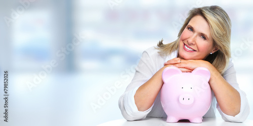 Bild auf Leinwand Senior woman with piggy bank.