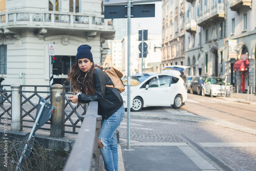 Beautiful girl posing in an urban context Beautiful girl posing in an urban context
