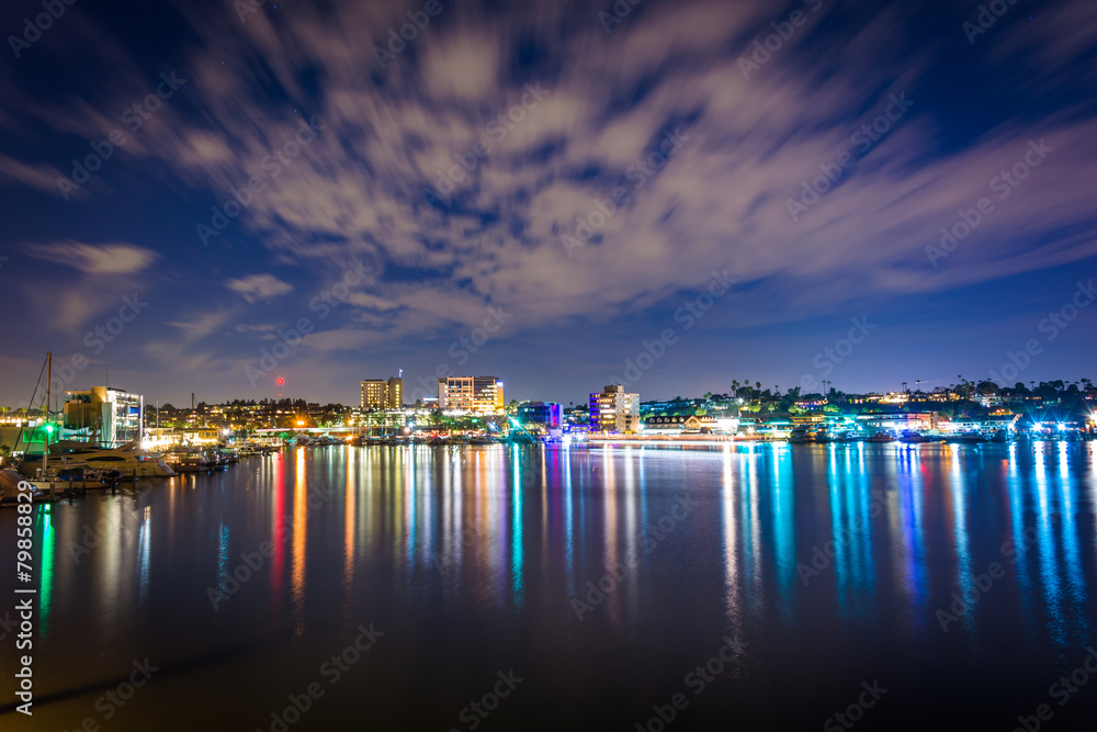 Fototapeta premium Clouds over the harbor at night, seen from the Via Lido Bridge,