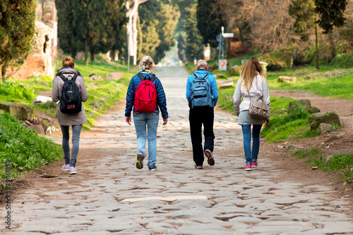 women walking in a park, ancient road