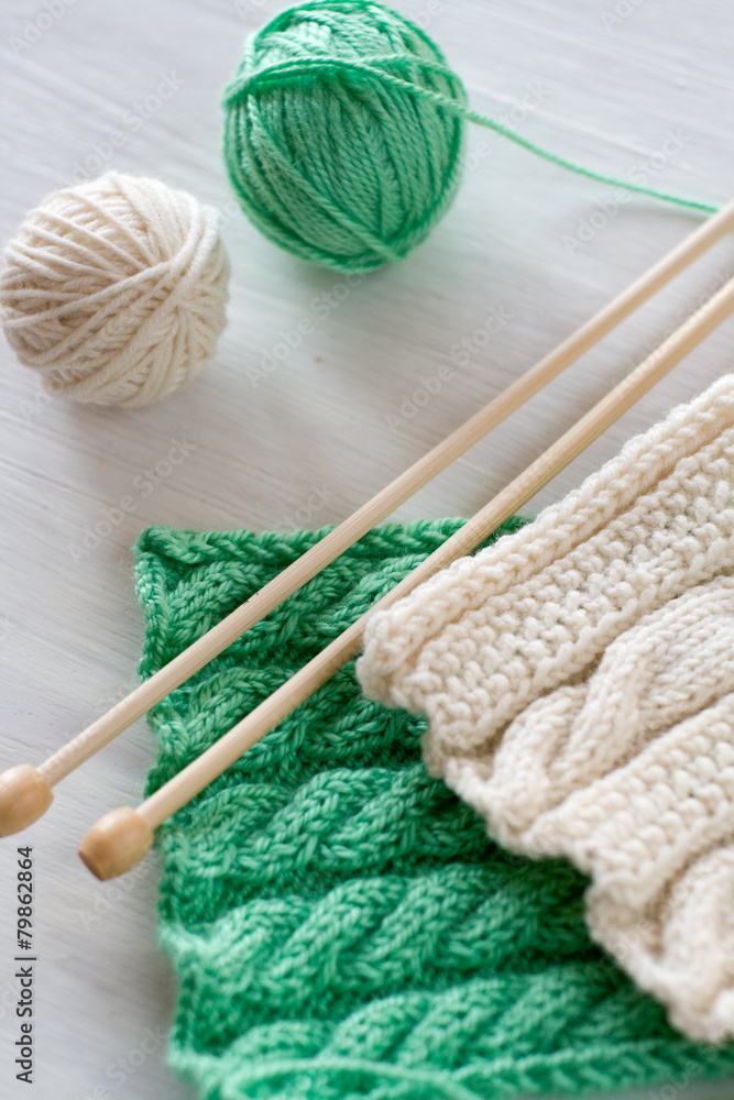 Two bright patterns and wooden knitting needles Two bright patterns and wooden knitting needles