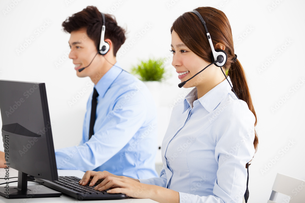 smiling business man and woman with headset working in office smiling business man and woman with headset working in office