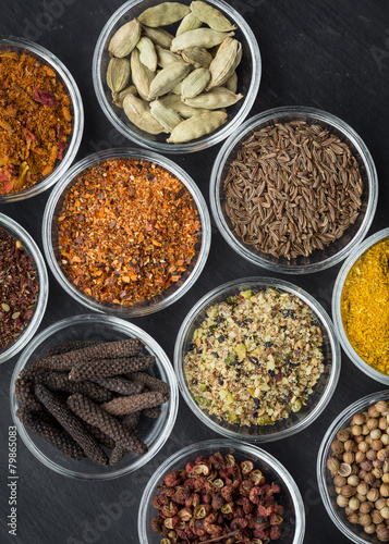 Various spices in small bowls from above
