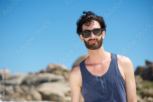 Attractive young man with sunglasses outdoors