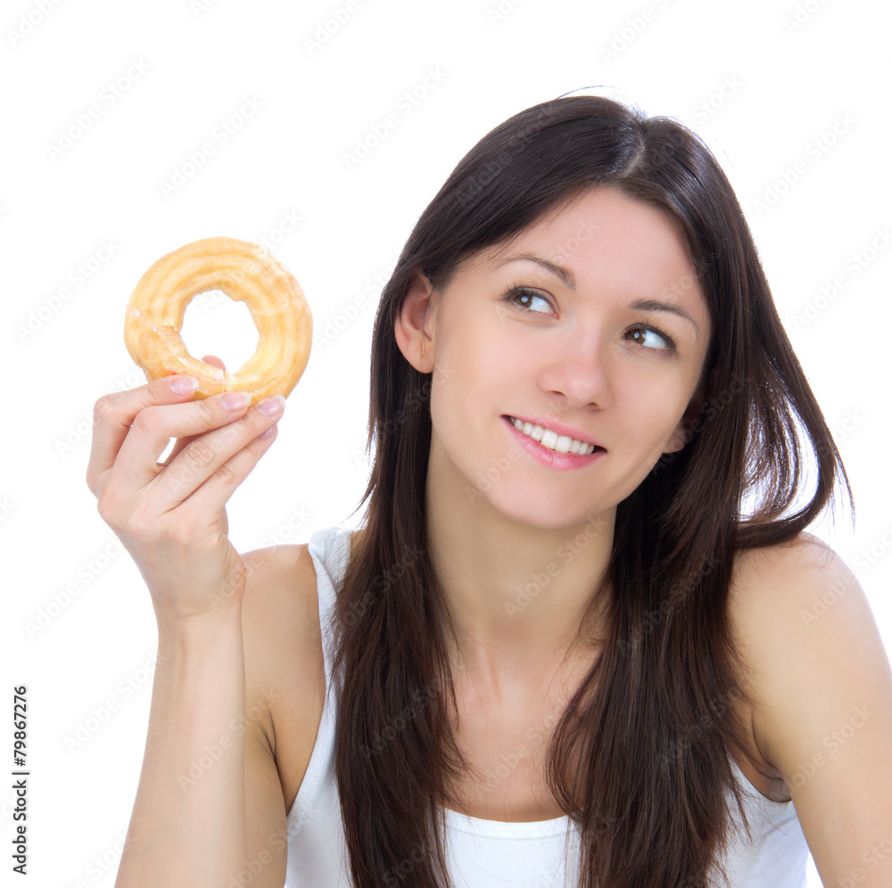 Woman enjoy sweet donut and looking at the corner. Woman enjoy sweet donut and looking at the corner.