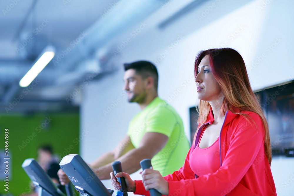 Group of people running on treadmills Group of people running on treadmills