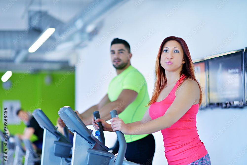 Group of people running on treadmills Group of people running on treadmills