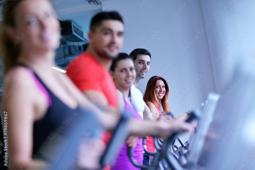 Group of people running on treadmills Group of people running on treadmills