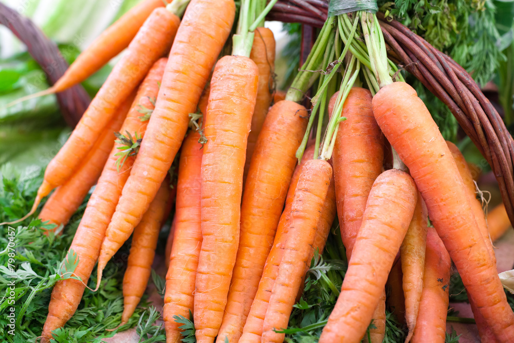 Close-up of organic carrots for sale at a market stall, La Close-up of organic carrots for sale at a market stall, La