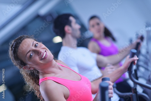 Group of people running on treadmills