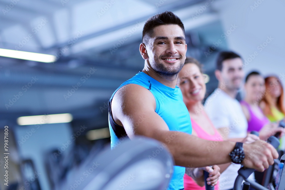 Group of people running on treadmills Group of people running on treadmills