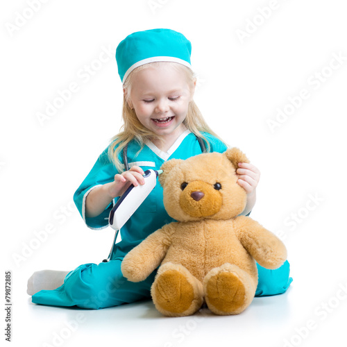 child girl playing doctor w...