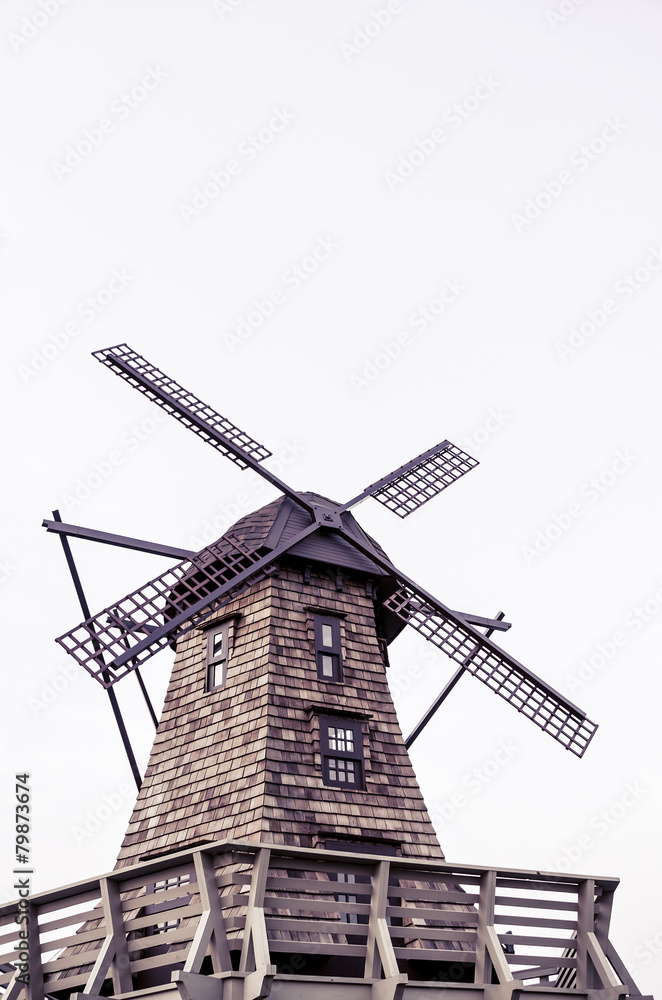 Windmill standing in white isolated background