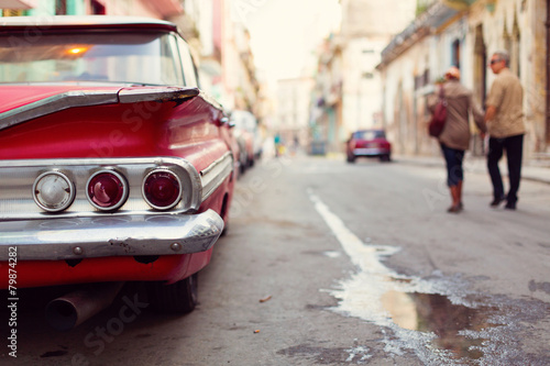 HAVANA - FEBRUARY 17: Classic car and antique buildings on Febru photo