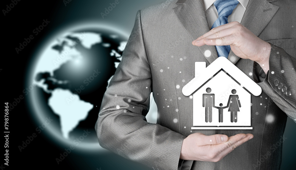 businessman protecting family in home with hands businessman protecting family in home with hands