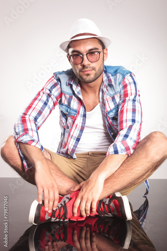 Fashion man sitting on the floor
