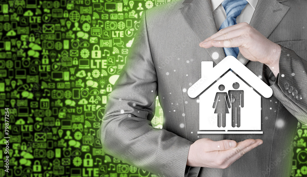 businessman protecting family in home with hands businessman protecting family in home with hands