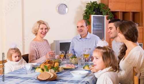 family sitting at table for dinner