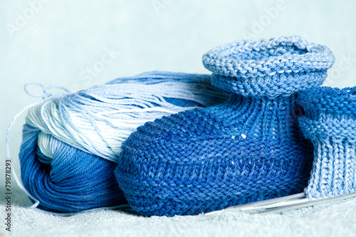 ball of blue-blue melange threads for knitting of bootees to the