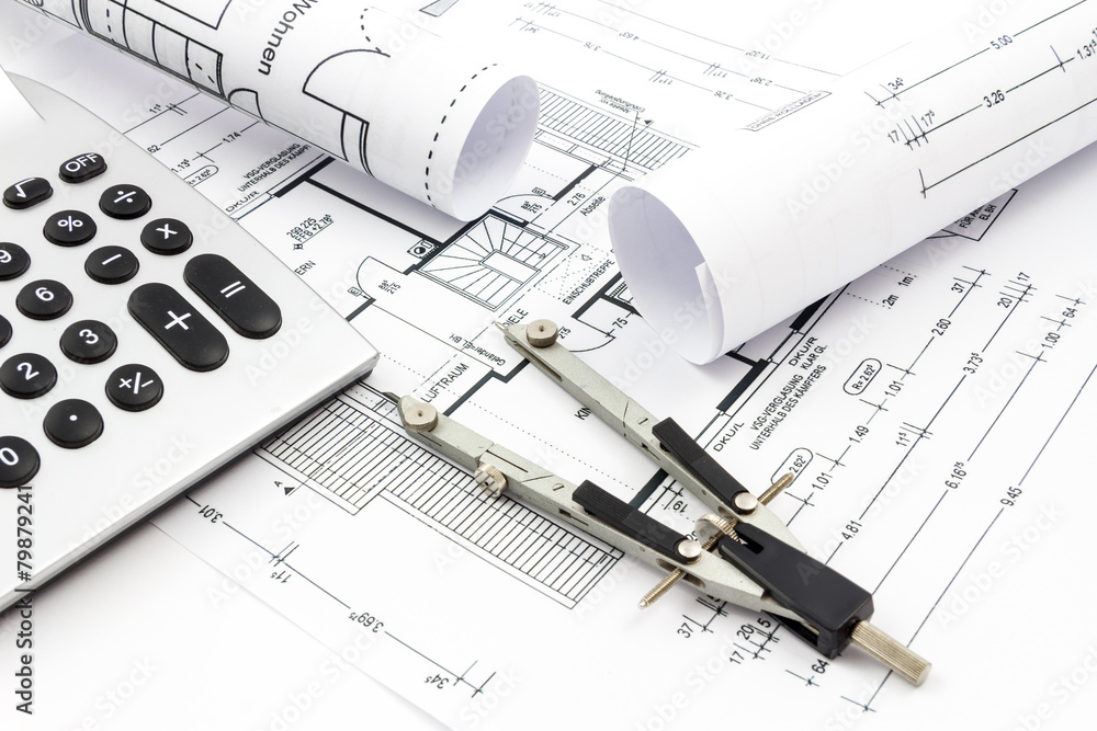 Architectural drawings of a house with compass and calculator Architectural drawings of a house with compass and calculator