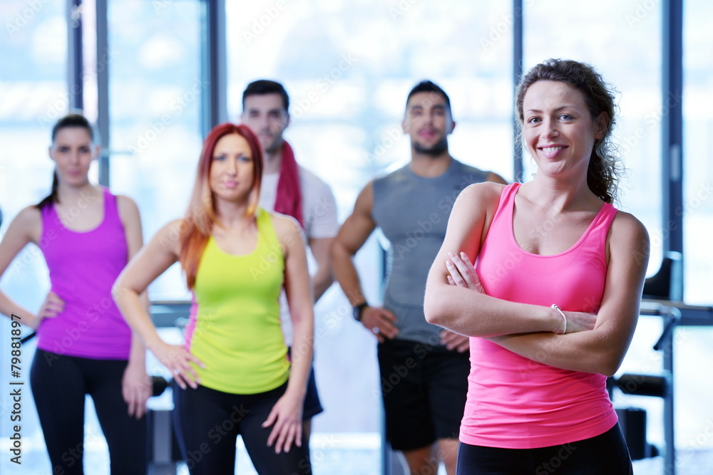 Group of people exercising at the gym