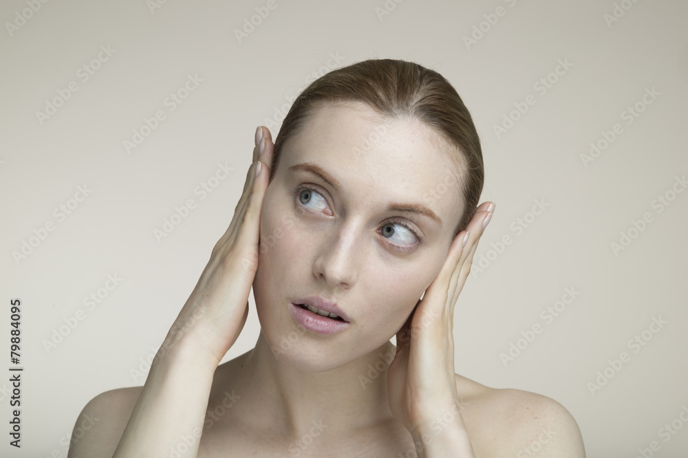 Women are blocking the ear by hand Women are blocking the ear by hand