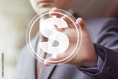 Businessman pushing button with dollar