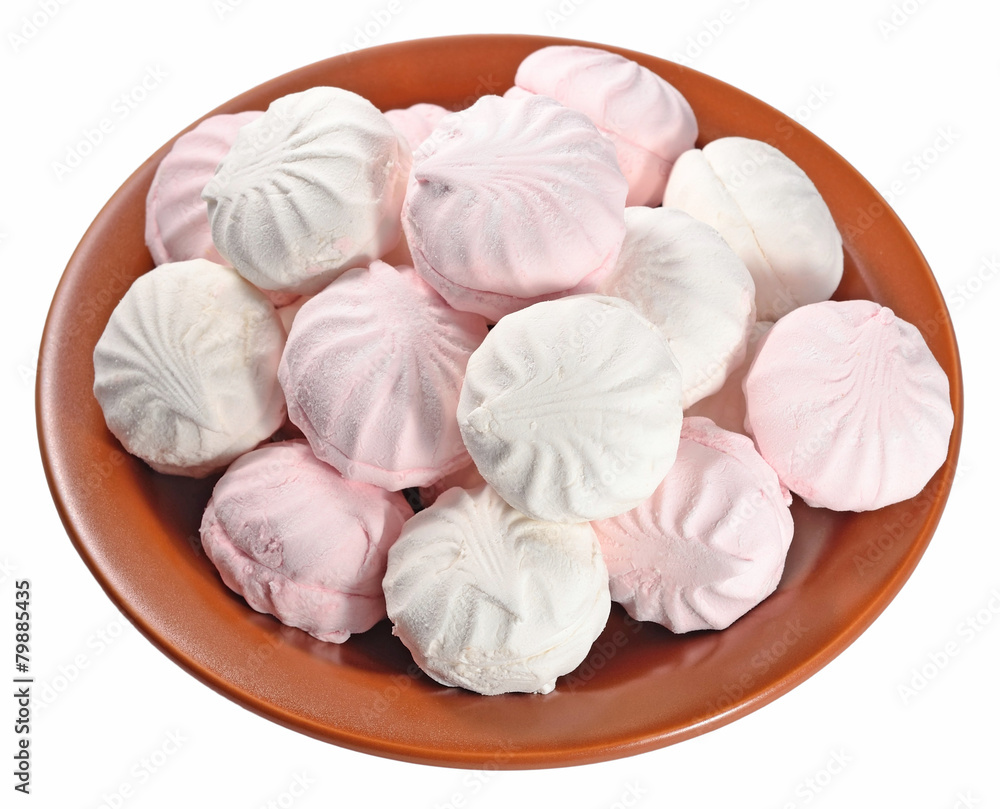 White and pink marshmallow on a ceramic plate on a white White and pink marshmallow on a ceramic plate on a white