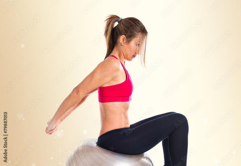 Fototapeta premium Woman doing sport with fitball