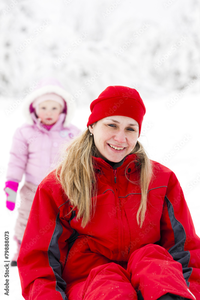 Fototapeta premium portrait of mother with little daughter in winter