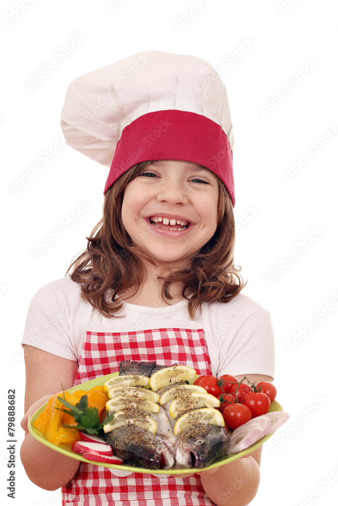 happy little girl cook with fish happy little girl cook with fish