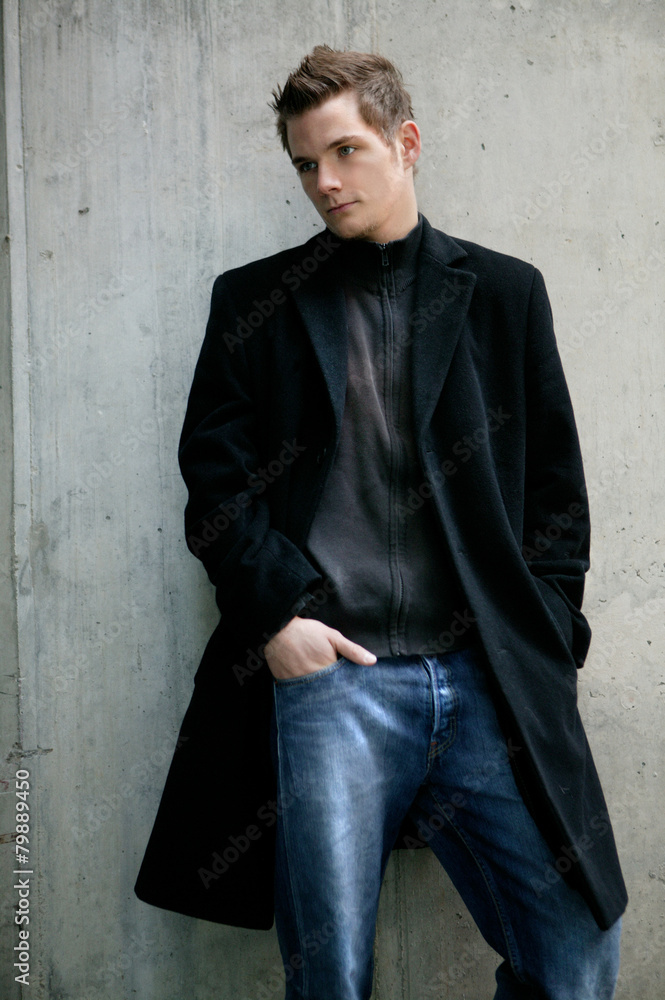 young man leaning on wall young man leaning on wall
