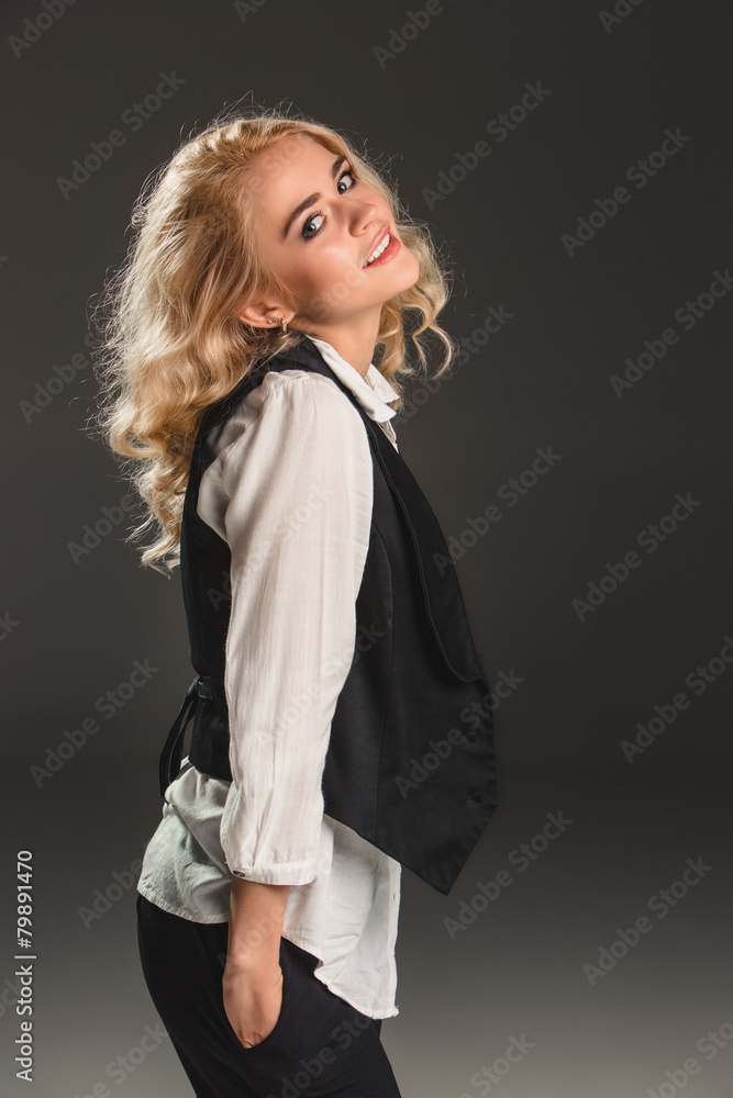 Beauty blond woman on a gray background Beauty blond woman on a gray background
