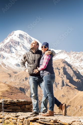 young couple on a background of mountains © lobodaphoto