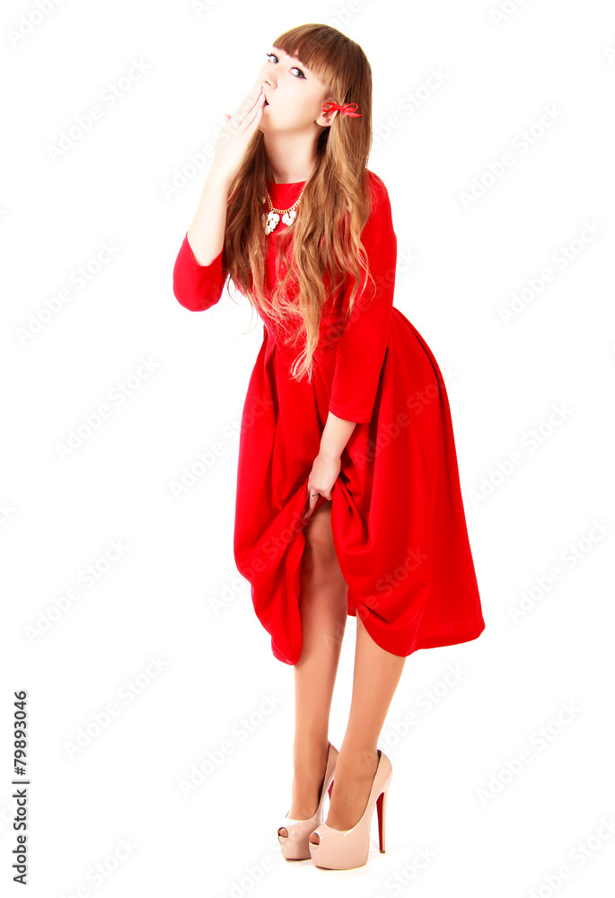 Young woman in a bright red evening dress