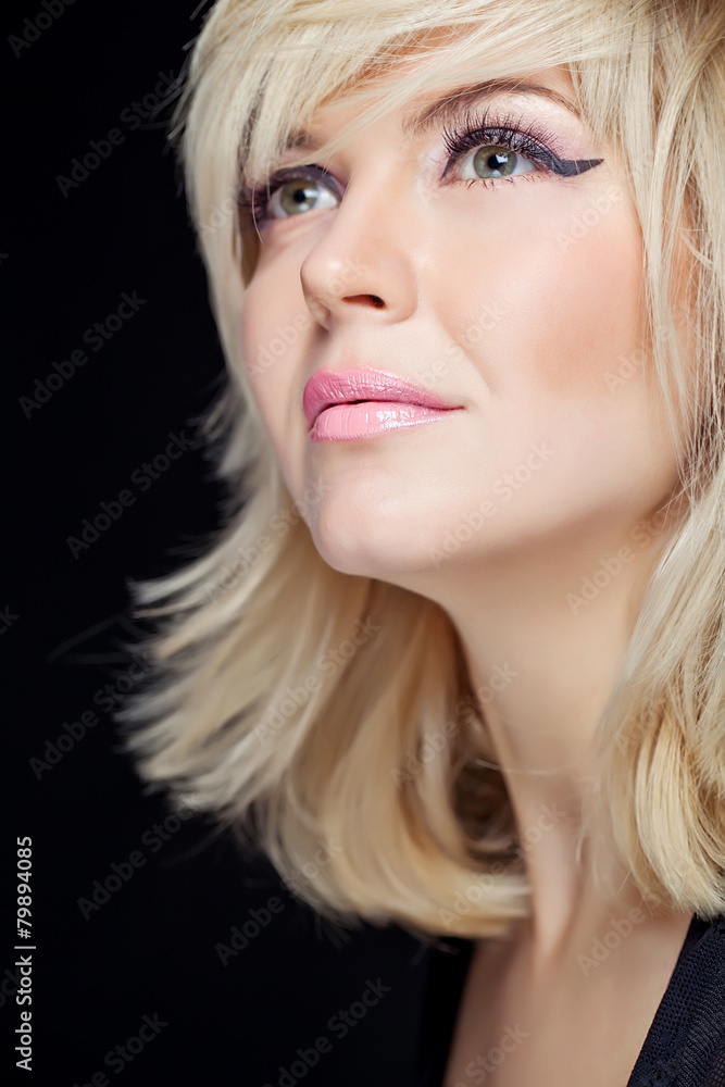 Portrait sexy blonde in studio, black background Portrait sexy blonde in studio, black background