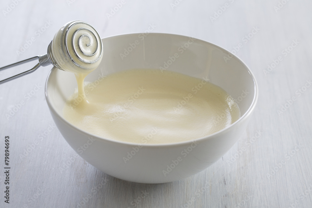 whisking egg with sugar and vanilla whisking egg with sugar and vanilla