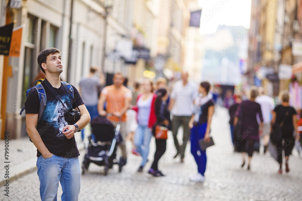 Male traveler walks through the streets Male traveler walks through the streets