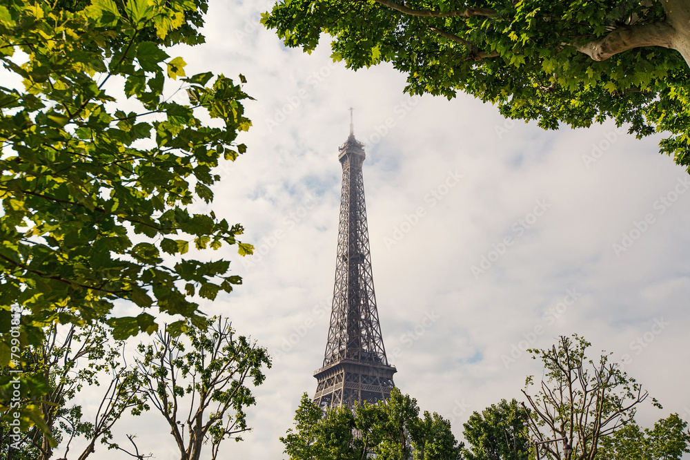 Eiffel Tower against cloudy sky. Paris, France.