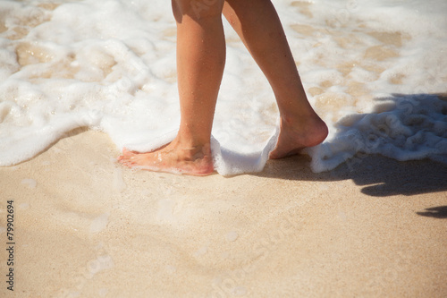 legs of a woman on the beach