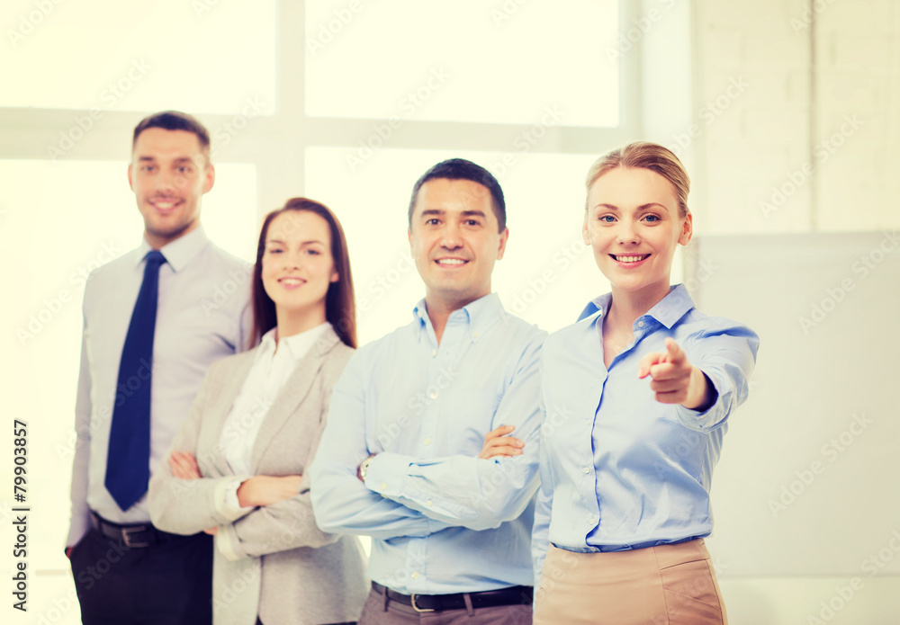 businesswoman in office pointing finger at you businesswoman in office pointing finger at you