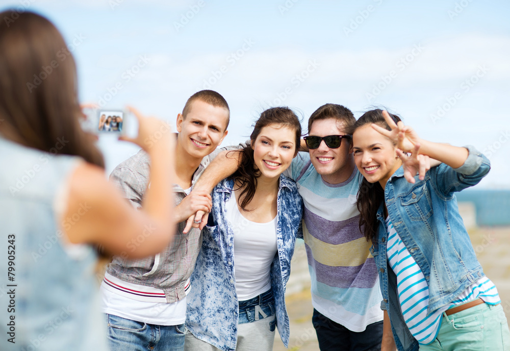 teenagers taking photo outside teenagers taking photo outside