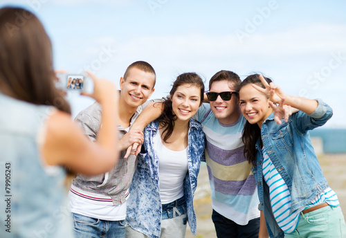 teenagers taking photo outside
