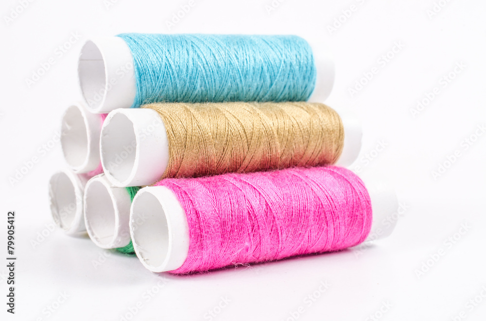 multicolor sewing threads on white background, multicolor sewing threads on white background,