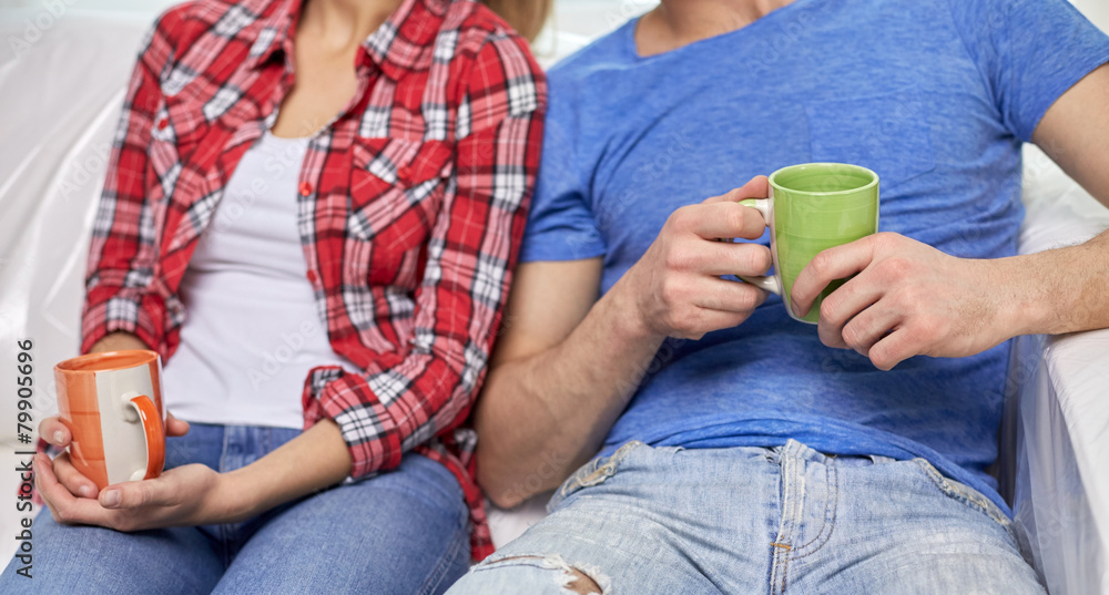 close up of couple relaxing on sofa in new home close up of couple relaxing on sofa in new home