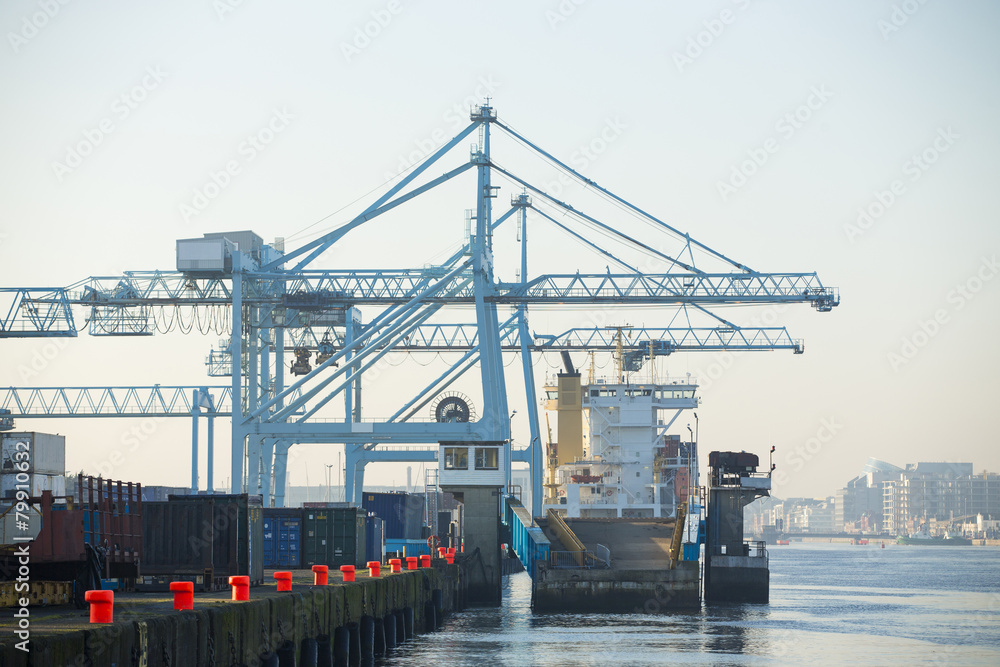 Commercial harbor with large industrial cranes