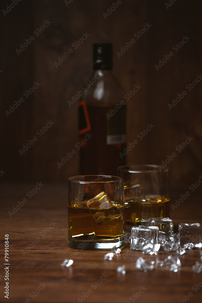 shot of whiskey on old wooden surface shot of whiskey on old wooden surface