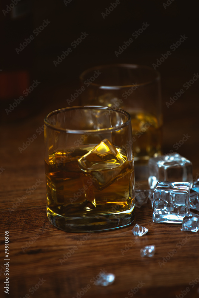 shot of whiskey on old wooden surface shot of whiskey on old wooden surface